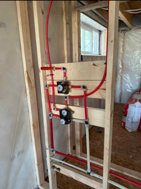 PEX manifold and shower valve rough-in installed by Mackston